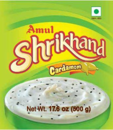 100% VEG AMUL SHRIKHAND CARDAMOM NET WT. 17.6 OZ (500 G) logo