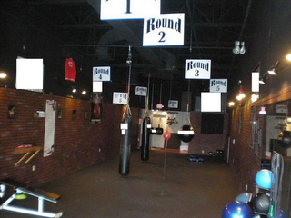 9 ROUND GET FIT NEVER HIT THE END OF BORING CARDIO COMPLEX MACHINES AND SILLY ROUTINES GETTING AMERICA FIT, 9 ROUND AT AT TIME! 30 MINUTE BOXING/KICKBOXING CIRCUIT logo