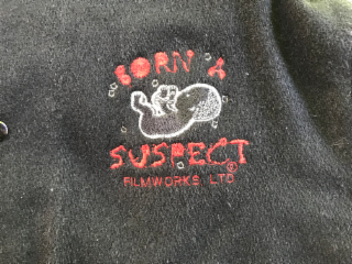 BORN A SUSPECT logo