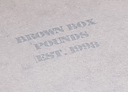 BROWN BOX POUNDS EST. 1998 logo