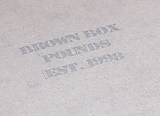 BROWN BOX POUNDS EST.1998 logo