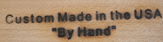 CUSTOM MADE IN THE USA "BY HAND" logo