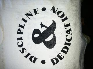 DISCIPLINE & DEDICATION logo