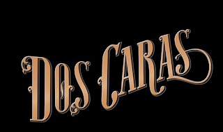 DOS CARAS logo