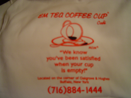 EM TEA COFFEE CUP CAFE M.O.M. "WE KNOW YOU'VE BEEN SATISFIED , WHEN YOUR CUP IS EMPTY." LOCATED ON THE CORNER OF OAKGROVE & HUGHES BUFFALO, NEW YORK (716) 884-1444 logo