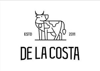 ESTD 2011 DE LA COSTA logo
