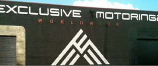 EXCLUSIVE MOTORING WORLDWIDE logo