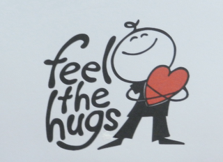 FEEL THE HUGS logo