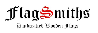 FLAGSMITHS HANDCRAFTED WOODEN FLAGS logo