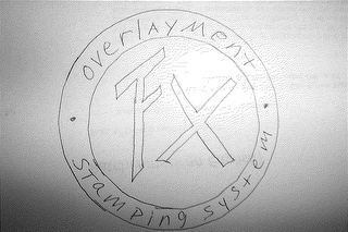 FX OVERLAYMENT STAMPING SYSTEM logo
