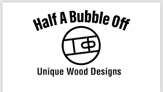 HALF A BUBBLE OFF UNIQUE WOOD DESIGNS logo