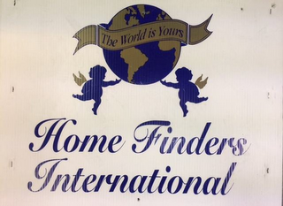 HOME FINDERS INTERNATIONAL THE WORLD IS YOURS logo