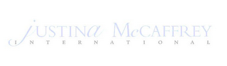 JUSTINA MCCAFFREY INTERNATIONAL logo