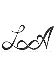 LA THE LUXURY IS IN THE PRESENT logo