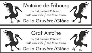 L'ANTOINE DE FRIBOURG AU LAIT CRU / MIT ROHMILCH WITH RAW MILK / CON LATTE CRUDO DE LA GRUYÈRE / GLÂNE GRAF ANTOINE logo