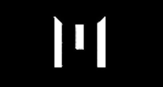 M logo