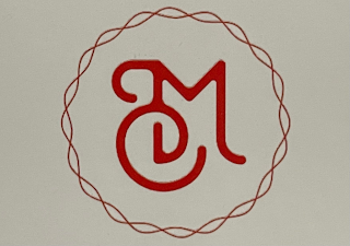 M C logo