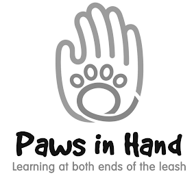PAWS IN HAND LEARNING AT BOTH ENDS OF THE LEASH logo