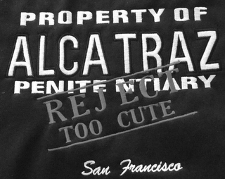 PROPERTY OF ALCATRAZ PENITENTIARY REJECT TOO CUTE SAN FRANCISCO logo