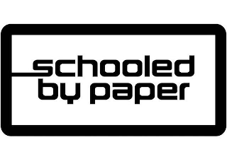 SCHOOLED BY PAPER logo