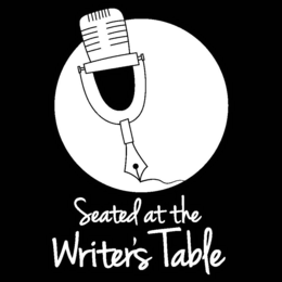 SEATED AT THE WRITER'S TABLE logo