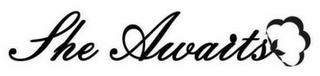 SHE AWAITS logo