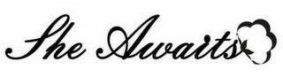 SHE AWAITS logo