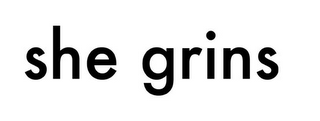SHE GRINS logo