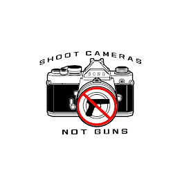 SHOOT CAMERAS NOT GUNS SCNG logo