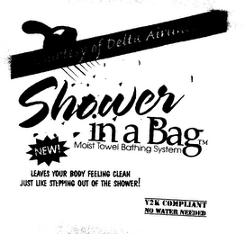 SHOWER IN A BAG COURTESY OF DELTA AIRLINES MOIST TOWEL BATHING SYSTEM NEW LEAVES YOUR BODY FEELING CLEAN JUST LIKE STEPPING OUT OF THE SHOWER! Y2K COMPLIANT NO WATER NEEDED logo