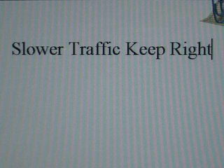 SLOWER TRAFFIC KEEP RIGHT logo
