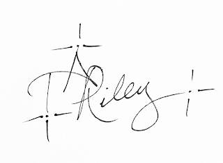 T A RILEY logo
