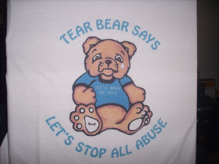 TEAR BEAR SAYS "IT'S OK TO TELL" LET'S STOP ALL ABUSE logo