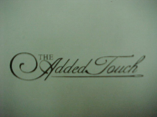 THE ADDED TOUCH logo