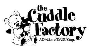 THE CUDDLE FACTORY A DIVISION OF DANU CORP. logo
