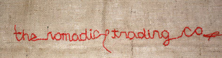 THE NOMADIC TRADING CO. logo