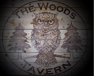 THE WOODS TAVERN logo