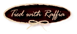 TIED WITH RAFFIA logo