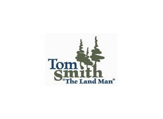 TOM SMITH "THE LAND MAN" logo