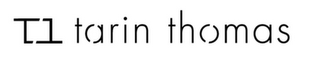 TT TARIN THOMAS logo