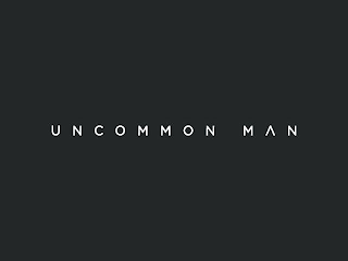 UNCOMMON MAN logo