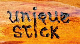 UNIQUE STICK logo