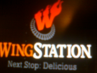 W WINGSTATION NEXT STOP: DELICIOUS logo