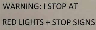 WARNING: I STOP AT RED LIGHTS + STOP SIGNS logo