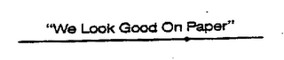 "WE LOOK GOOD ON PAPER" logo