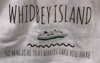 WHIDBEY ISLAND SO MAGICAL THAT FERRIES TAKE YOU THERE logo