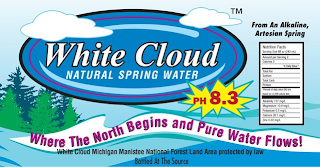 WHITE CLOUD NATURAL SPRING WATER FROM AN ALKALINE, ARTESIAN SPRING PH 8.3 WHERE THE NORTH BEGINS AND PURE WATER FLOWS! WHITE CLOUD MICHIGAN MANISTEE NATIONAL FOREST LAND AREA PROTECTED BY LAW BOTTLED AT THE SOURCE logo