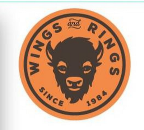 WINGS AND RINGS SINCE 1984 logo