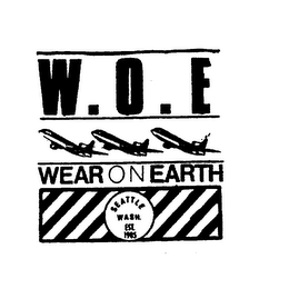 W.O.E. WEAR ON EARTH SEATTLE WASH. EST. 1985 logo