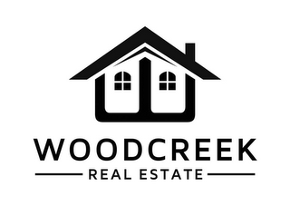 WOODCREEK REAL ESTATE logo